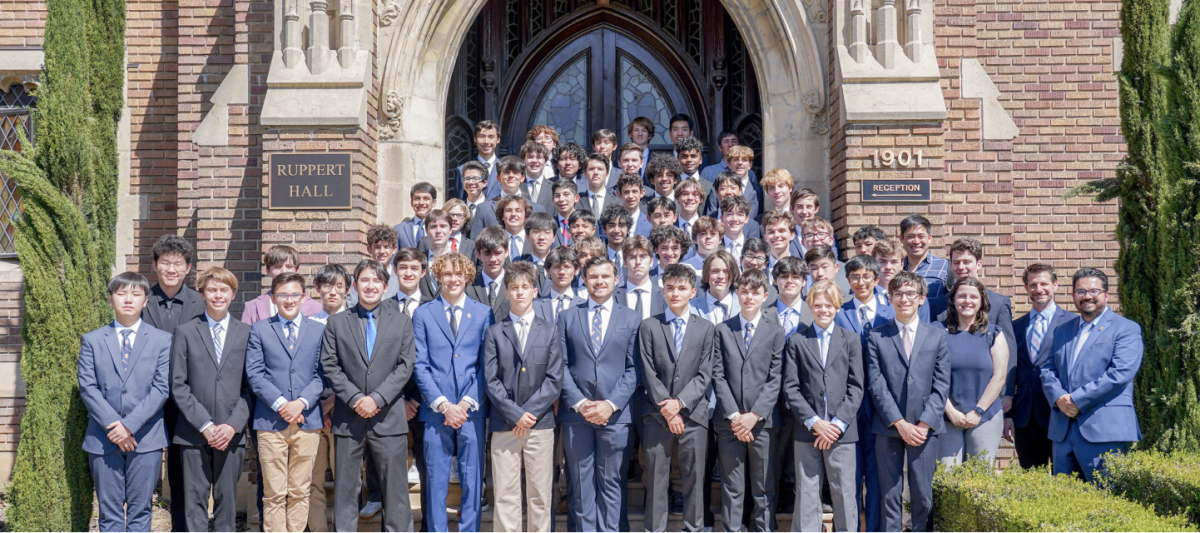 LOYOLA DEBATE TEAM POSES in front of Ruppert Hall